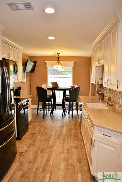 All new cabinets, appliances, farmhouse sink, and 