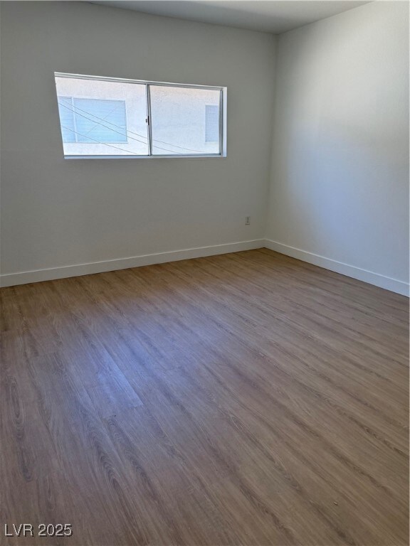Empty room featuring plenty of natural light and w