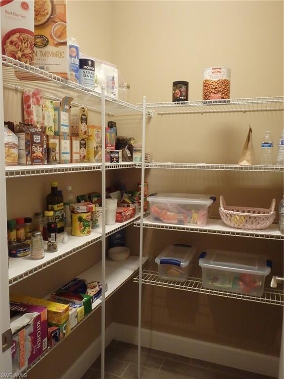 Enormous pantry with open shelving. This is 1 of 2