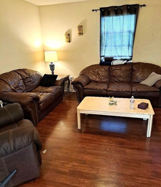 Living room featuring dark wood-type flooring