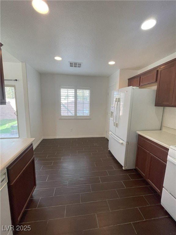 Kitchen with white fridge with ice dispenser, a we