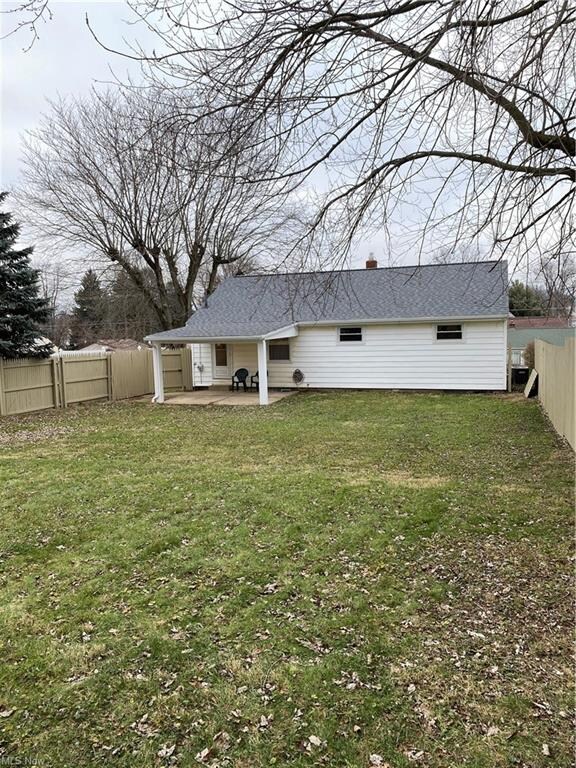 Large fenced in back yard w/ cement patio off of k