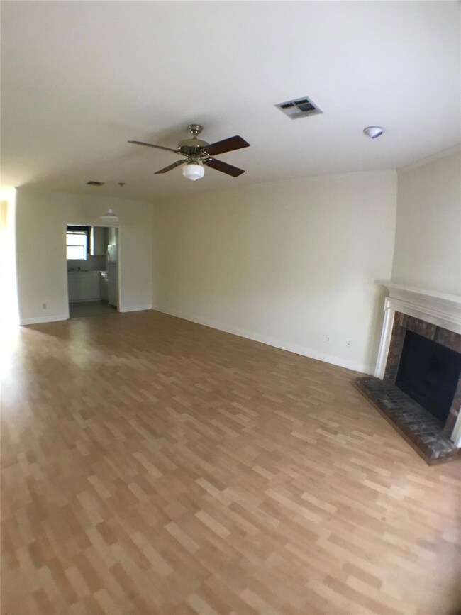 Unfurnished living room featuring light wood-styl