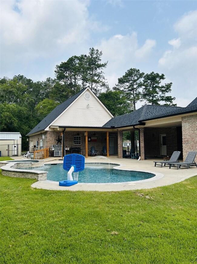 Wonderful pool and back of the house has covered a