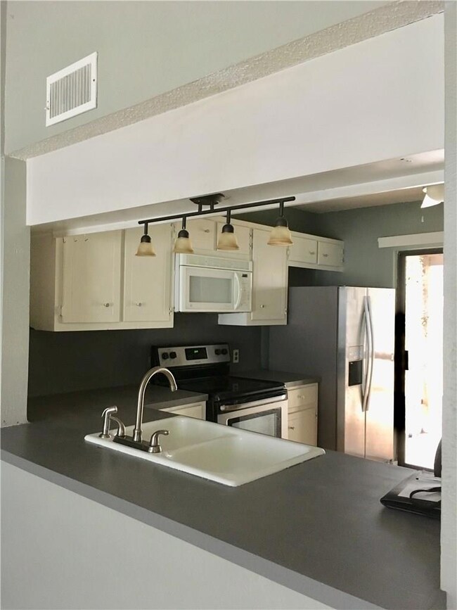 Kitchen opens to living room