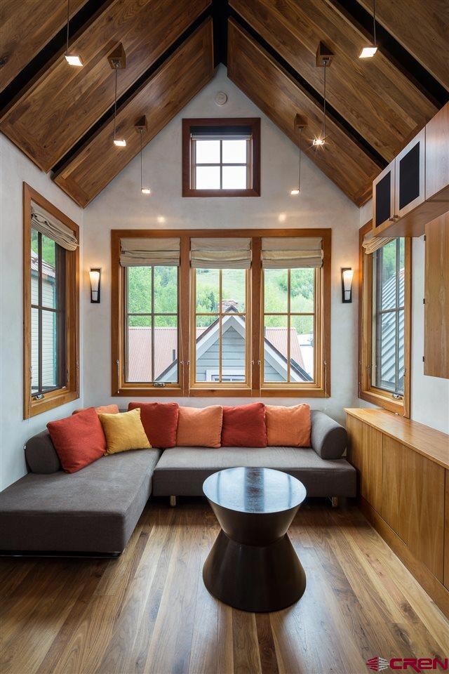LIVING AREA BOASTS VAULTED CEILINGS AND PLENTY OF 
