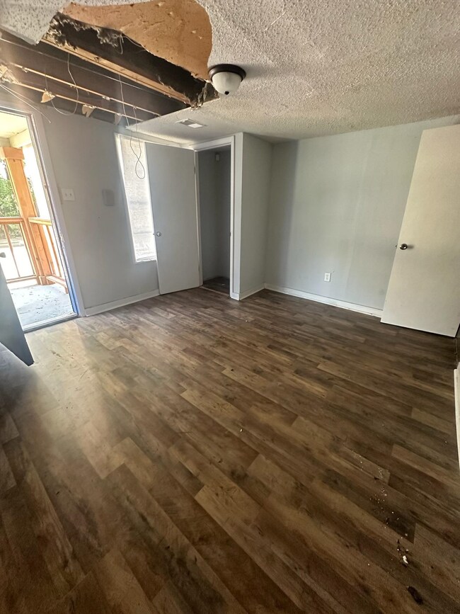 Entrance foyer featuring a textured ceiling and ha