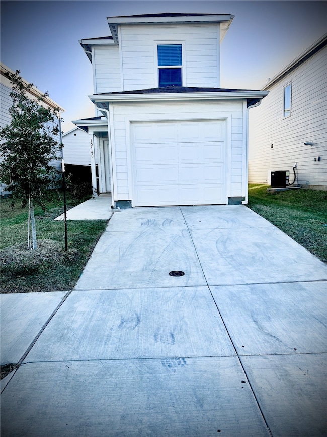 Traditional home featuring driveway