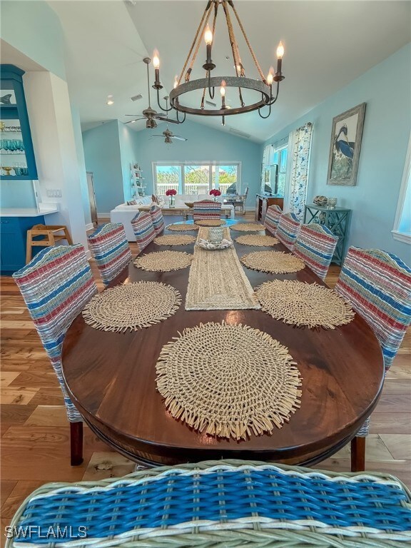 Dining area featuring ceiling fan with notable cha