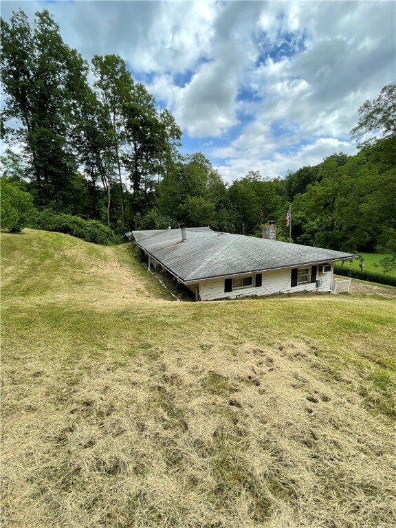 A view of the side and back of the home