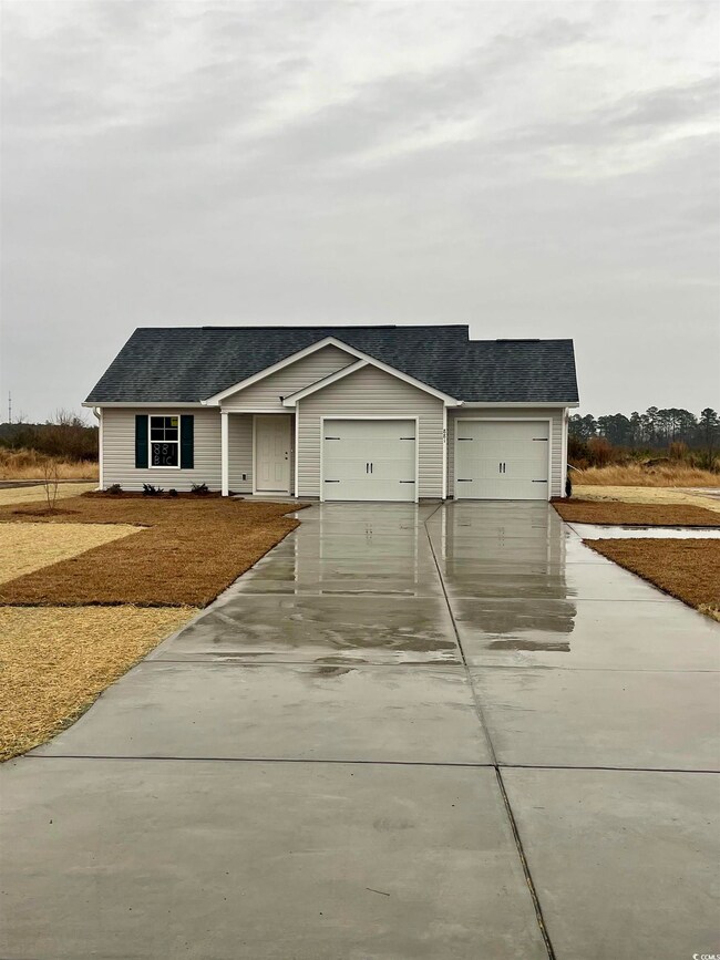View of front of property with a garage