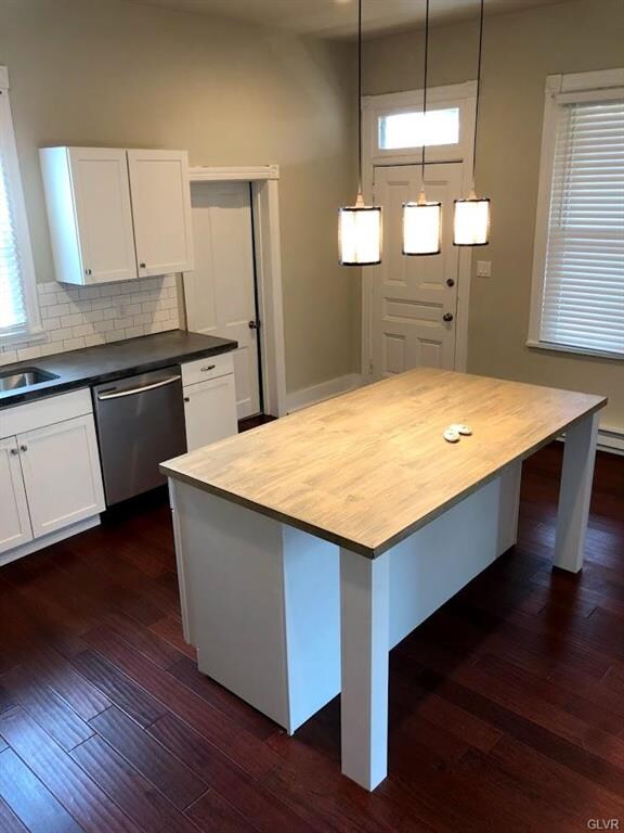 Kitchen-View facing rear entrance. Pictured is bra