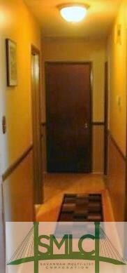 Wood flooring throughout the living room and hallw