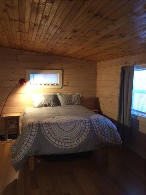 Wonderful wood themed bedroom. This...