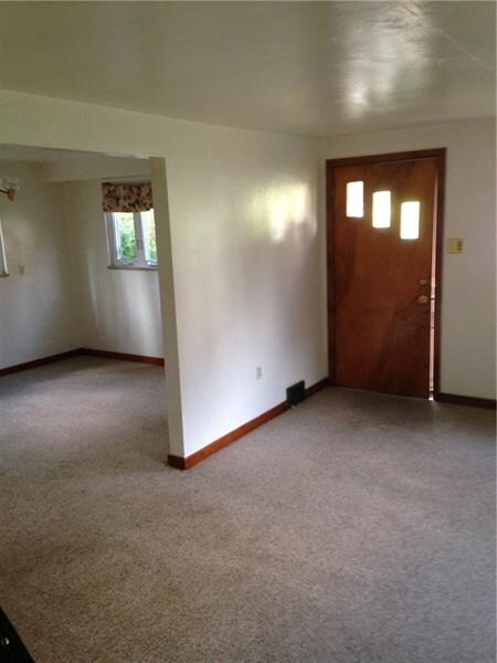 View from steps looking at living room and dining 