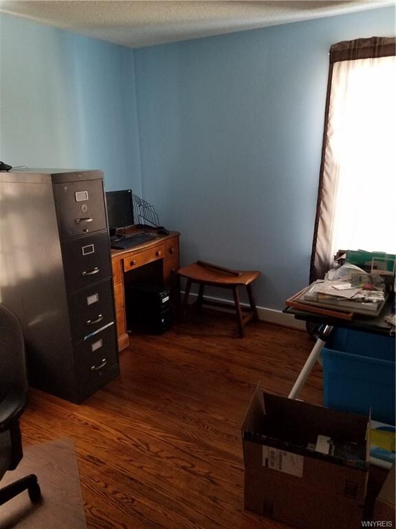 2nd bedroom with hardwood floors.