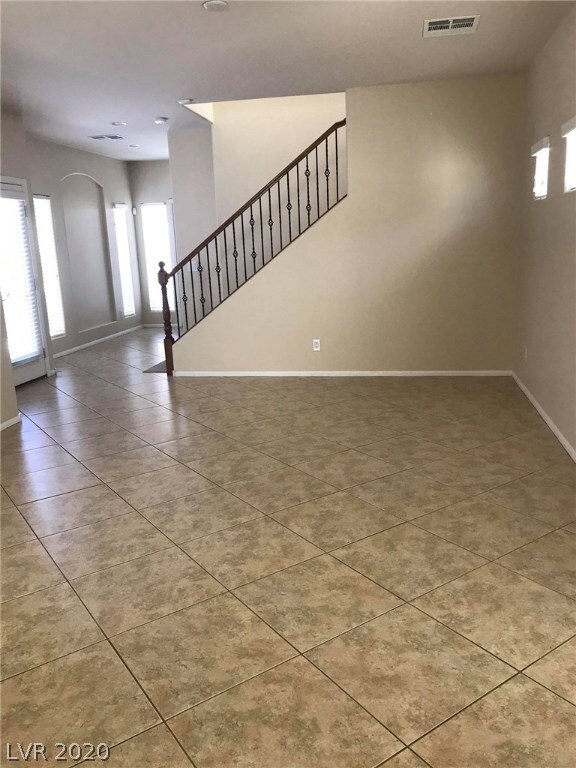Large size great room with oversize ceramic tiles.