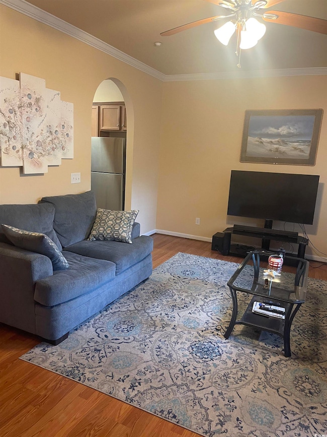 Living room with ceiling fan, wood-type flooring, 