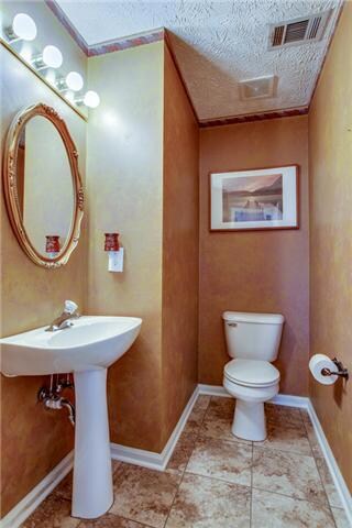 Located downstairs, this half-bath has ceramic tile flooring which was installed in February 2014.