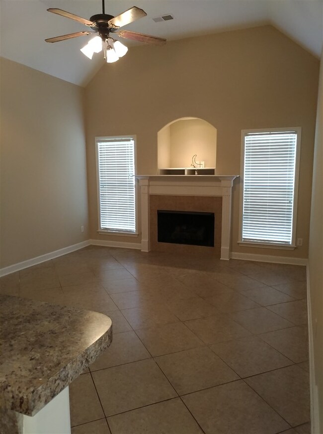 OPEN PLAN FROM KITCHEN.  TILED FLOOR, FIREPLACE HA