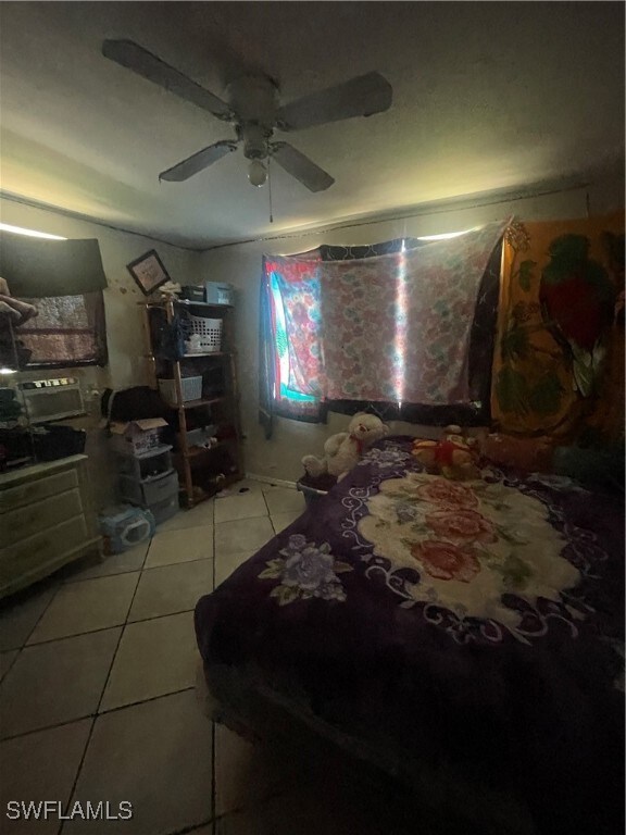 Bedroom with light tile patterned floors and ceili