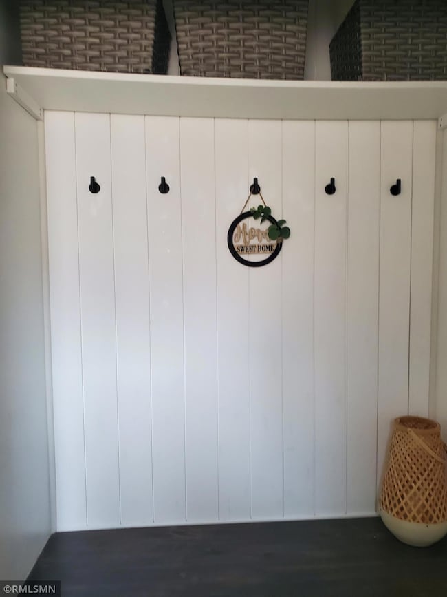 Welcome to 1217 68th Lane N!  As you walk in the front door you'll be greeted with this custom built closet.  You can leave you coats and shoes at the door.  To your right is the garage entrance.  Turn to your left to begin your tour!