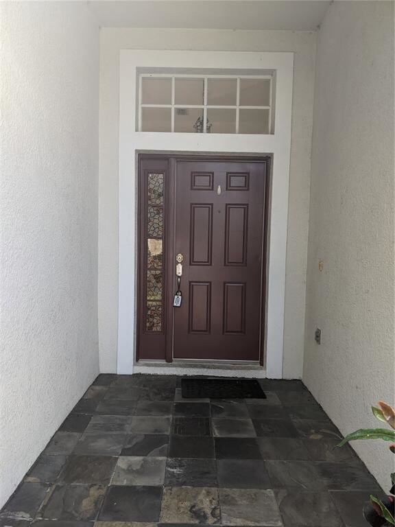 Covered front entry way with custom stone entance