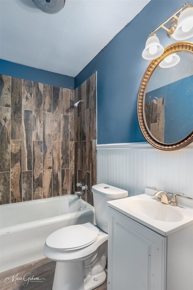 Full bathroom featuring vanity, tiled shower / bat