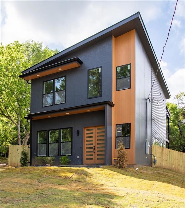 View of front of house featuring fence