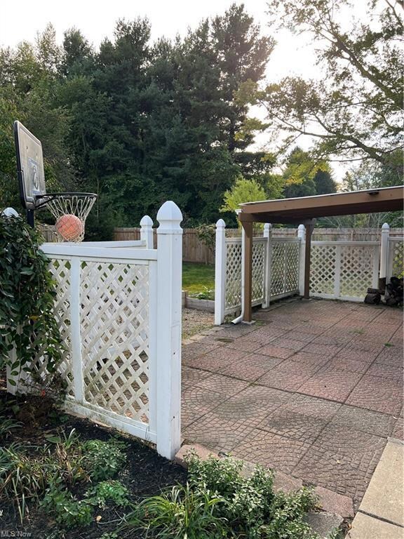 View of gate with a patio