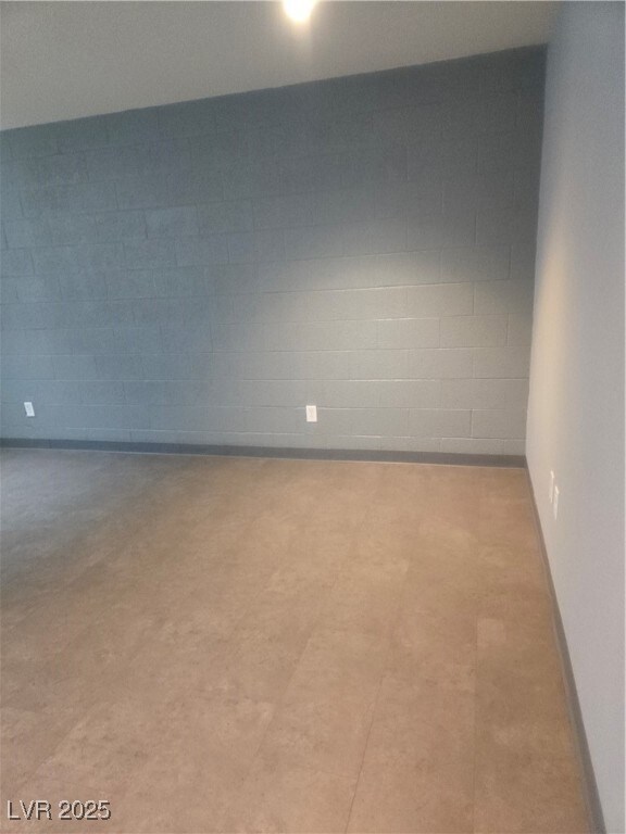 Empty room with concrete block wall
