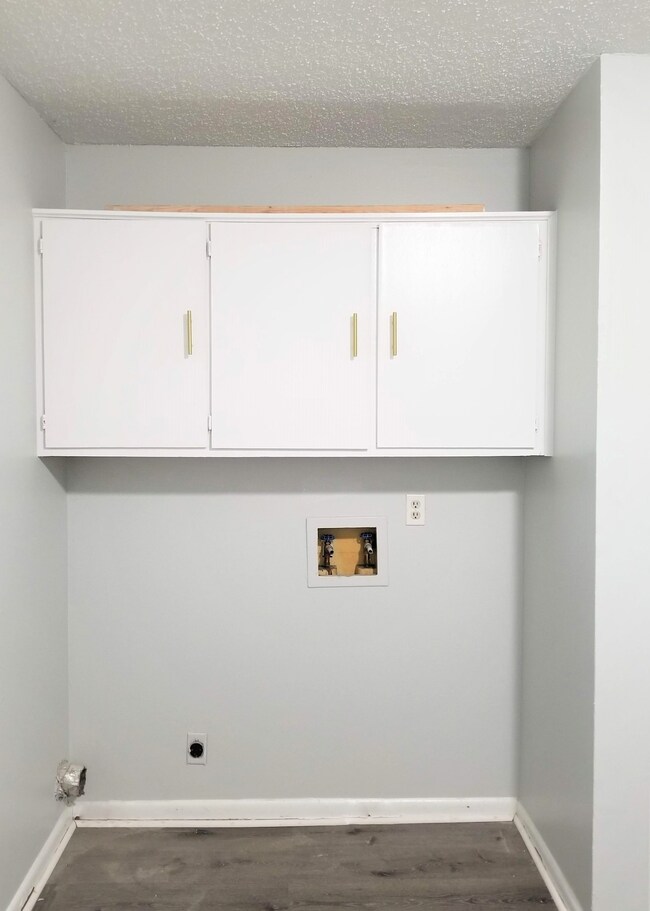 Laundry connection with above storage