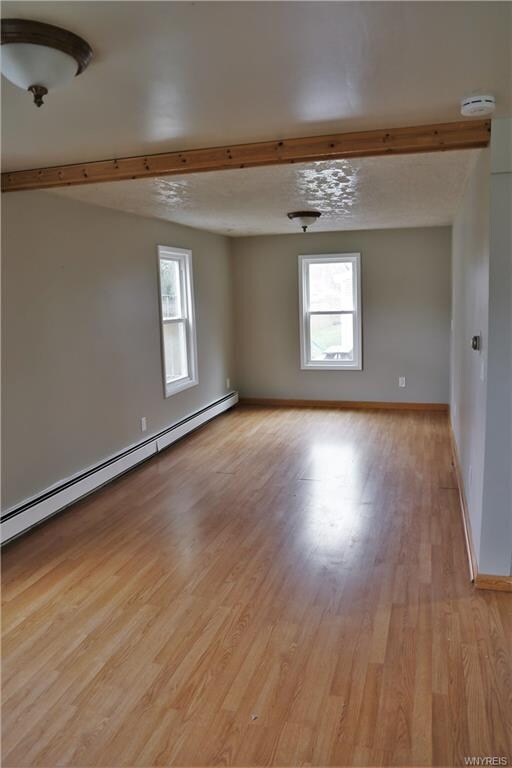 Living room.  Updated windows, flooring, carpet throughout.