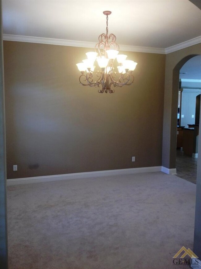 Spacious formal dining area with stunning chandelier