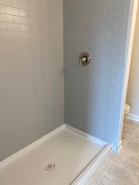 Lovely tile shower in the primary suite.