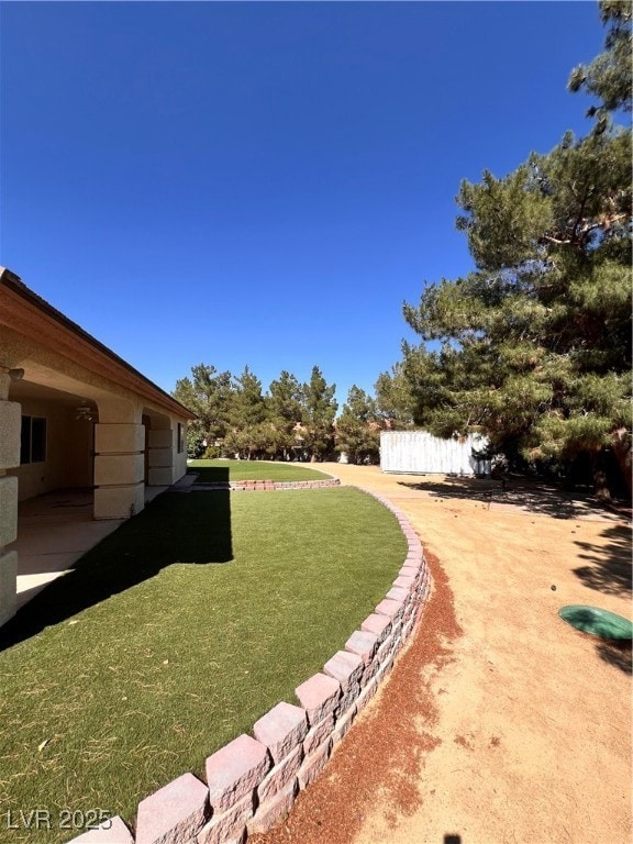 View of yard with a patio