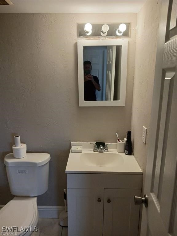 Bathroom with tile patterned flooring, vanity, and