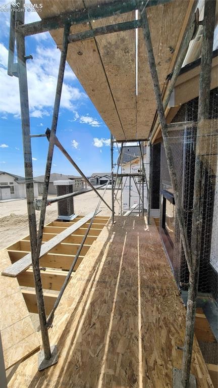 Composite Deck with a 2-sided fireplace and stairs to the yard. Please, excuse our dust as this home is currently under construction.