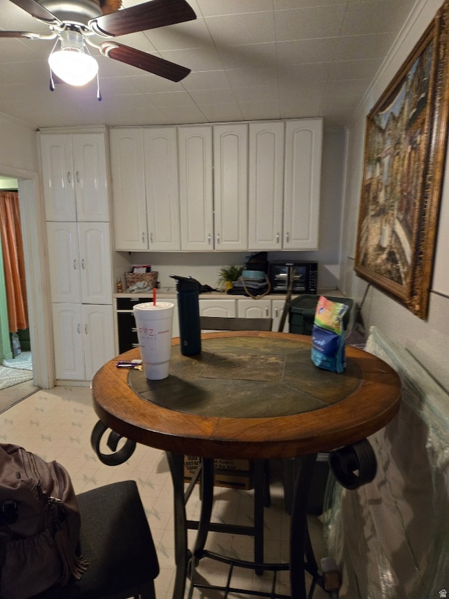Dining space featuring a ceiling fan