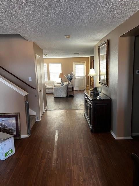 Corridor featuring dark hardwood / wood-style floo
