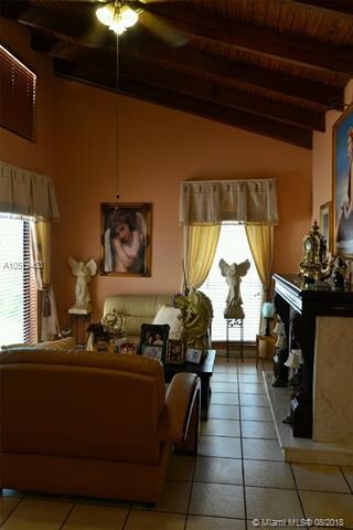 Living room with vaulted ceilings and custom made 