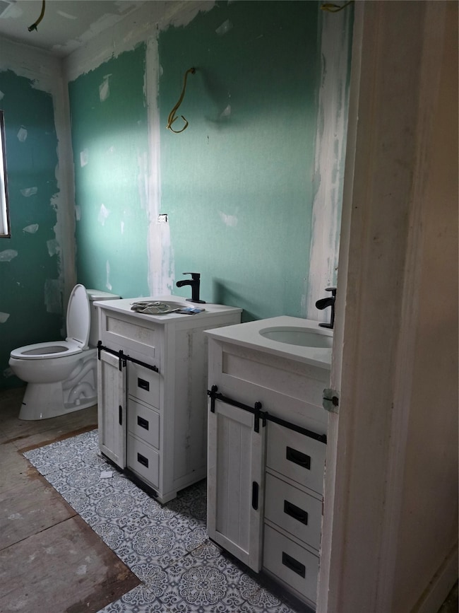 Double sinks with cute barn door vanities