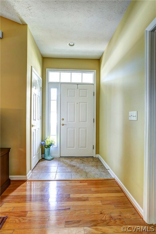 Tile Foyer with Coat Closet