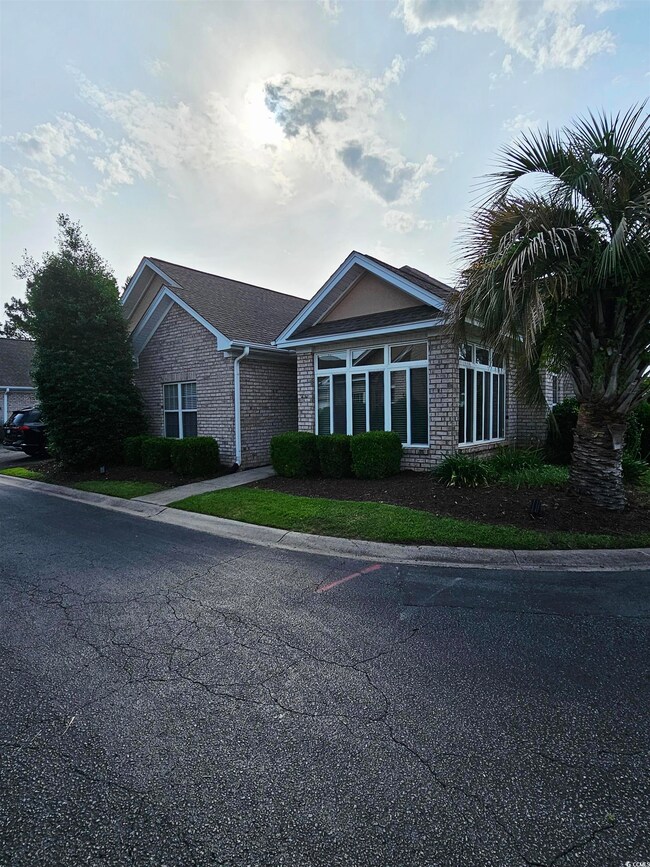 View of front of property with brick siding