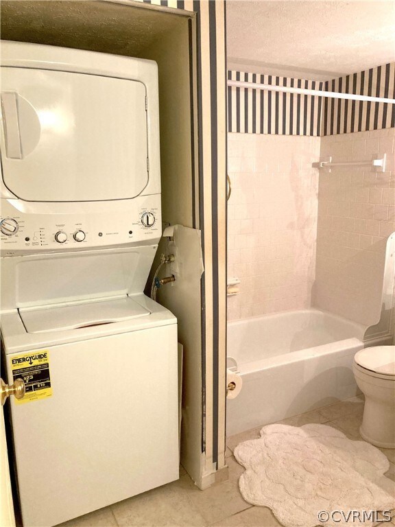 Full-size NEW stack washer/dryer in bathroom
