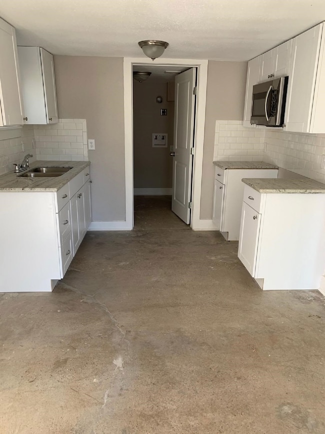 Washer/dryer, refrigerator, stove provided.