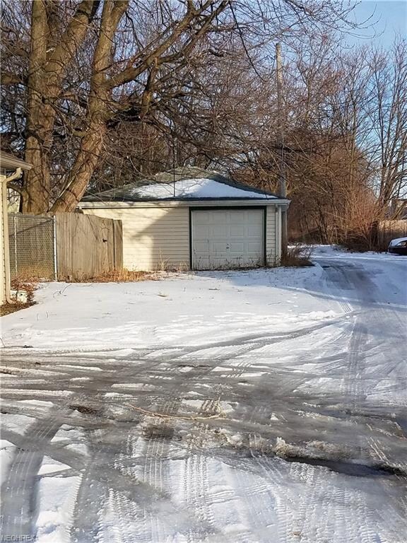 1.5 car garage, car accessible by alley. Man door 