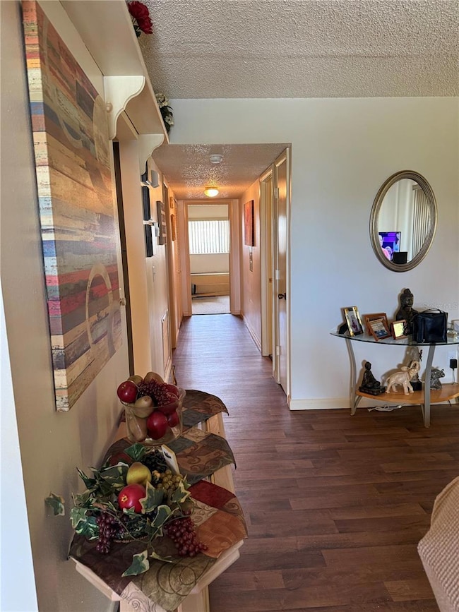 LIVING/DEN ENTRY HALLWAY TO BEDROOMS & BATHROOMS