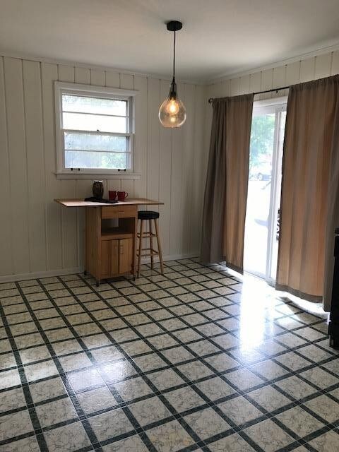 The spacious eat-in kitchen has a nice patio door that opens onto the carport.