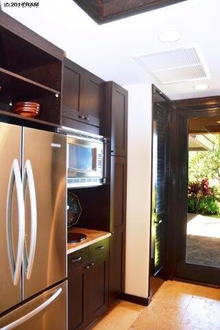 Kitchen and side door to BBQ area and guest quarte